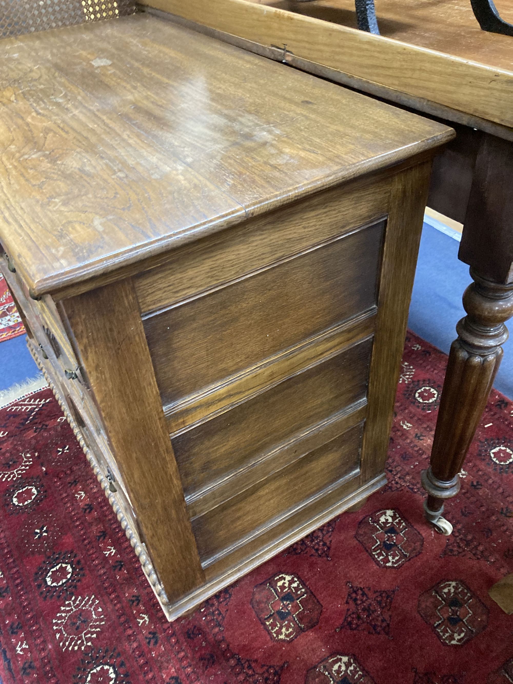 An early 20th century Jacobean style oak four drawer chest, width 81cm, depth 46cm, height 76cm